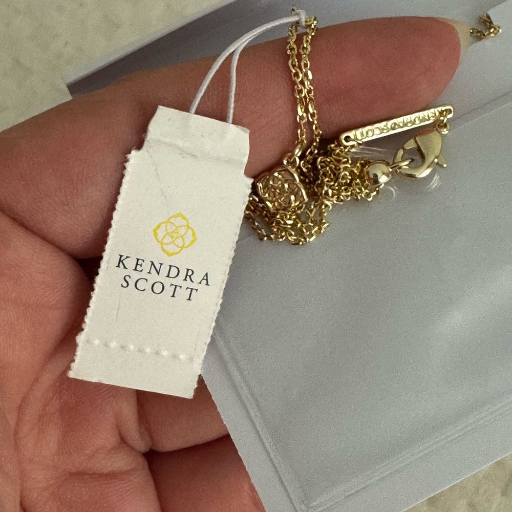 Kendra Scott 14k Plated Gold and Orange Sandstone Football Pendant Necklace - Picture 9 of 13